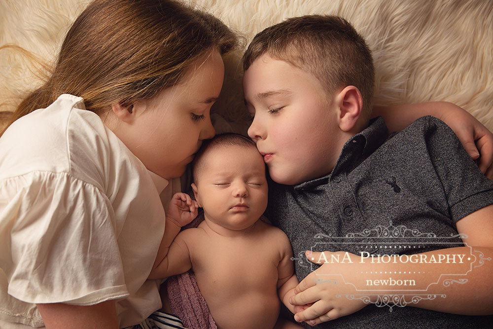 Newborn Photo with Brother and Sister