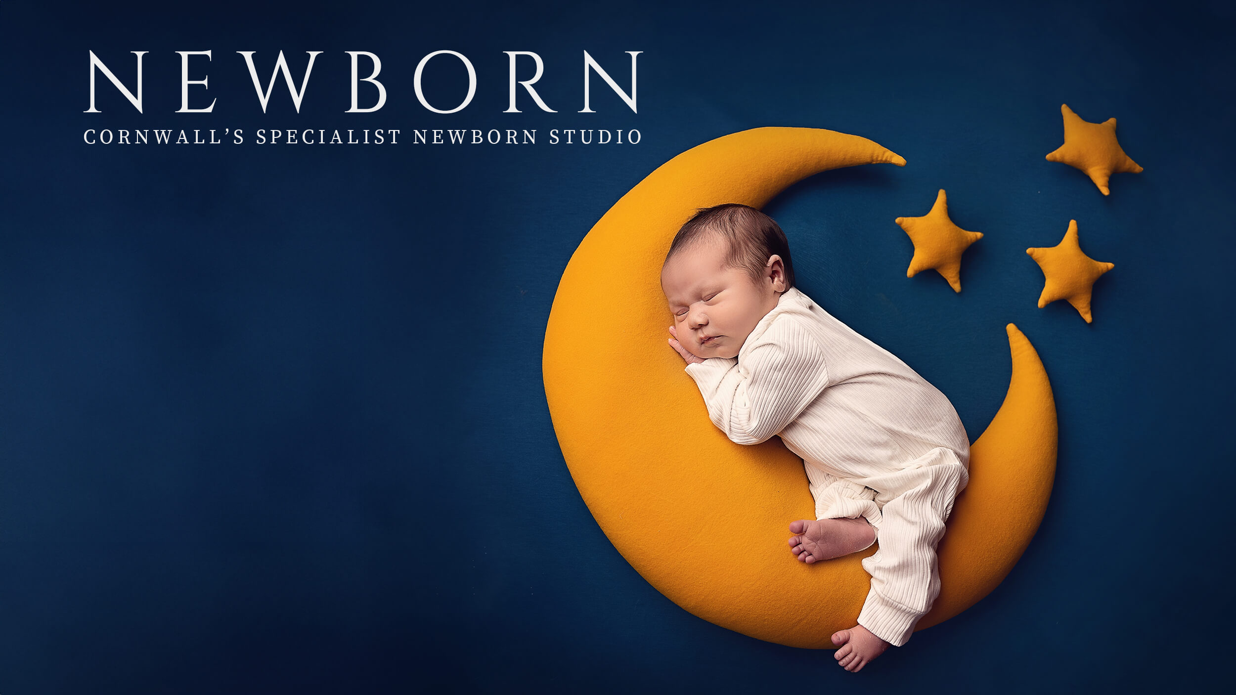 Newborn Baby Photo at a Cornwall Studio, nestled on a moon.