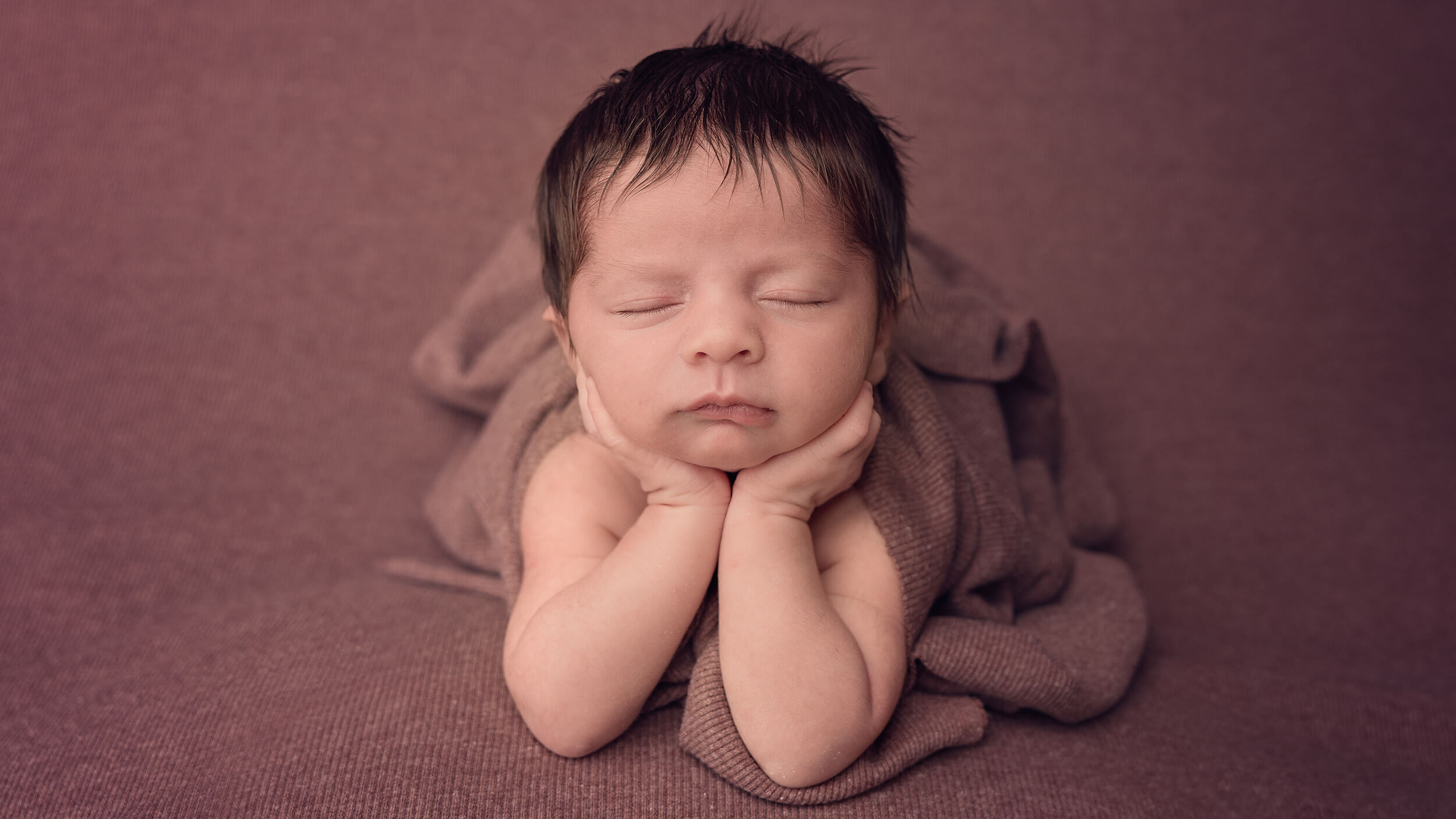 Baby posing at a Newborn photography session at AnA Photography in Cornwall.