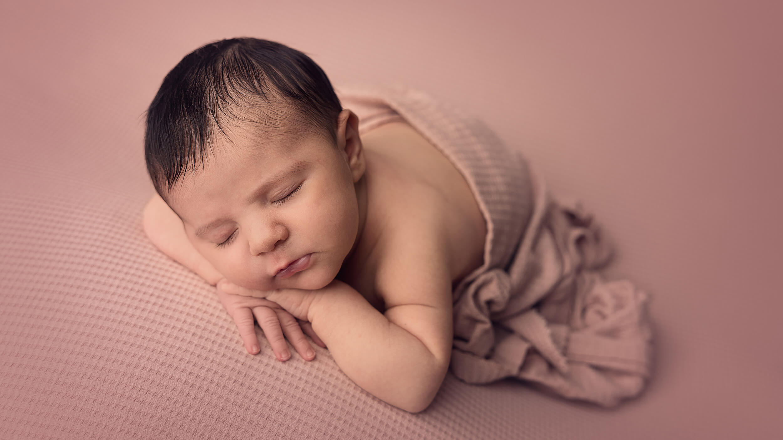a newborn baby girl asleep during her photo session with AnA Photography in Cornwall